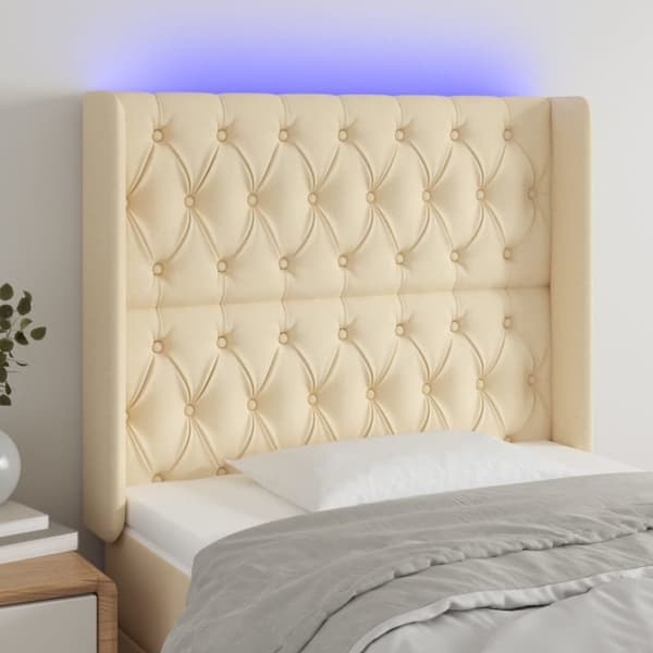 sengegavl med LED-lys 103x16x118/128 cm stof cremefarvet