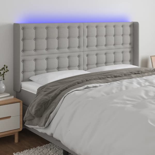 sengegavl med LED-lys 203x16x118/128 cm stof lysegrå