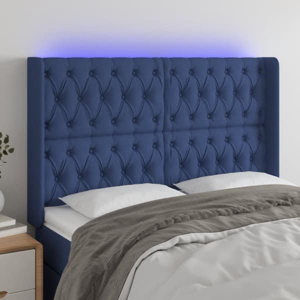 sengegavl med LED-lys 147x16x118/128 cm stof blå