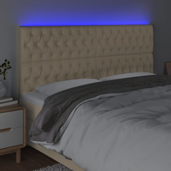 sengegavl med LED-lys 200x7x118/128 cm stof cremefarvet