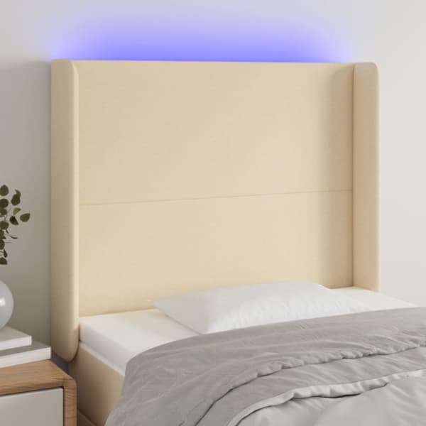 sengegavl med LED-lys 83x16x118/128 cm stof cremefarvet