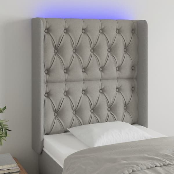 Sänggavel LED ljusgrå 83x16x118/128 cm tyg