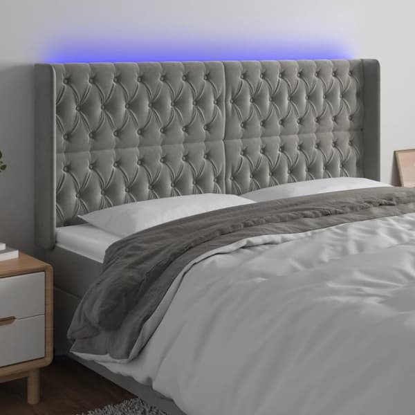 Sänggavel LED ljusgrå 183x16x118/128 cm sammet
