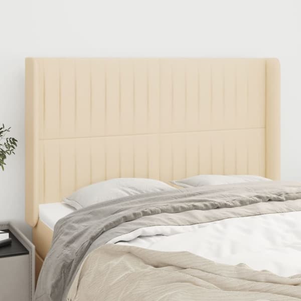Sänggavel med kanter gräddvit 147x16x118/128 cm tyg