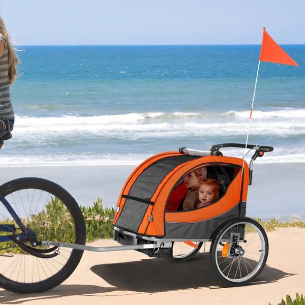 Cykelanhænger til småbørn, dobbeltsæde, max 40 kg. 2-i-1, konverteres til klapvogn. Foldbar med universal cykelkobling. Orange/grå.
