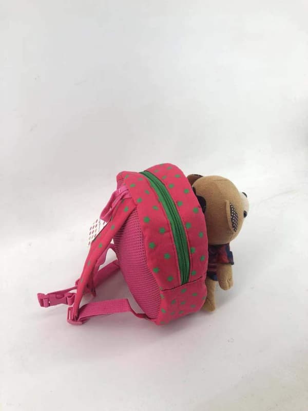 Lapsen reppu nalleturvahihnalla – pinkki