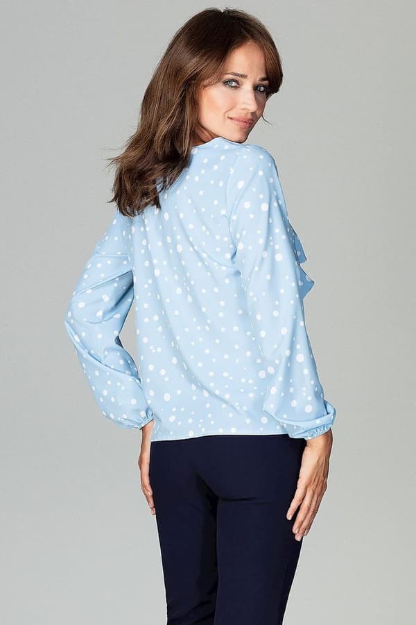 Blus med volang