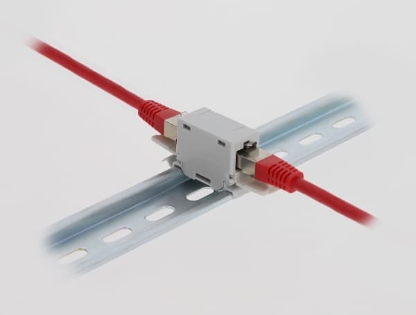 Delock RJ45-kobling Cat.6A hunn-til-hun med støvdeksel for DIN-skinnemontering grå