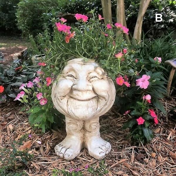 ansigt statue pot