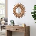 Miniatyrbilde 4 av 8: Rundt veggspeil med treramme og elegant design