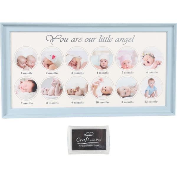 Blå souvenirram för foton och babys hand- och fotavtryck med bläck