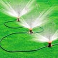 Miniatyrbild 1 av 4: Automatiskt bevattningssystem - Ej specificerat - 3 slangar på 180 cm - 3 sprinklers - 30 m räckvidd
