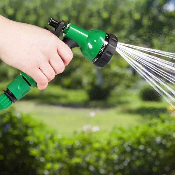 Relaxdays Trädgårdsslang med sprayhuvud, uttökbar och flexibel upp till 10 m, spiralformad, 7 strållägen, grön
