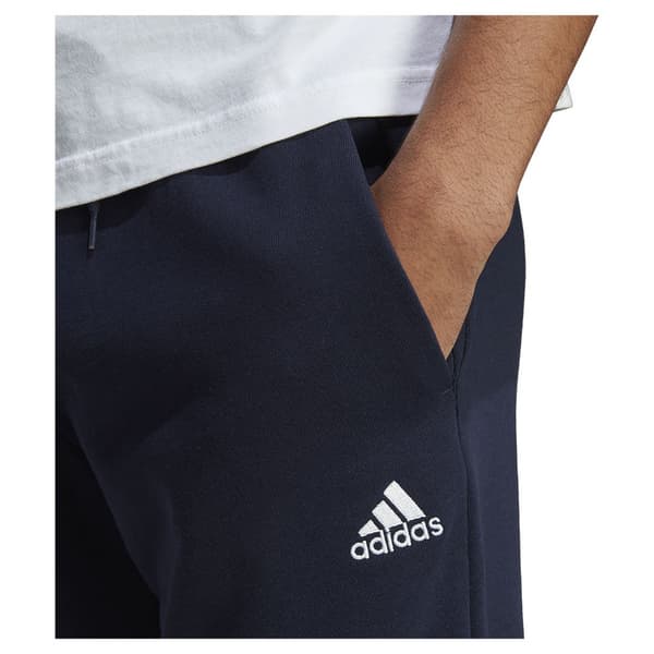 Adidas Byxor Essentials French Terry Tapered Cuff Logo Joggers Blå XS / Regular Man
