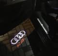 Miniatyrbild 1 av 2: LED-projektorlampa med AUDI logotyp till bildörren (2-pack)