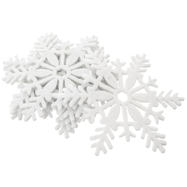 Hvite filtunderlegg i snøfnuggform til glass og panner