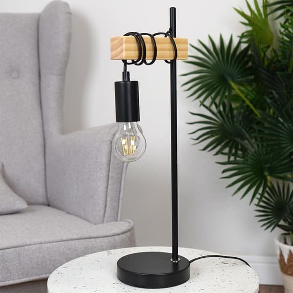 Elegant bordlampe i matt sort metall og tre for en industriell stil