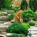 Miniatyrbilde 2 av 7: Buddha-statue med hode på kne