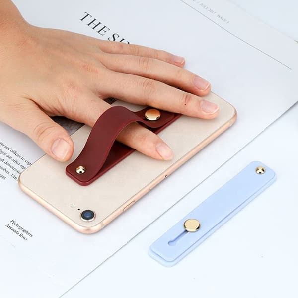Selvklebende fingertelefonholder med grå skyveknapp