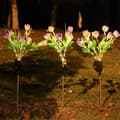 Miniatyrbillede 2 af 7: OBOSOE solcelledrevet lilla havelampe med 7 dråbeformede blomsterhoveder – LED udendørs belysning med jordspyd, kunstig blomst