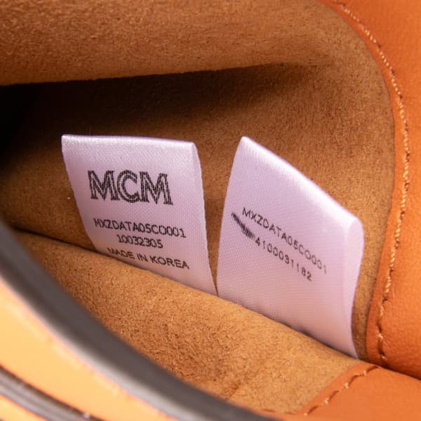 Pre-owned MCM Spanish Calfskin Embossed Logo Aren Lanyard Phone Case Brown