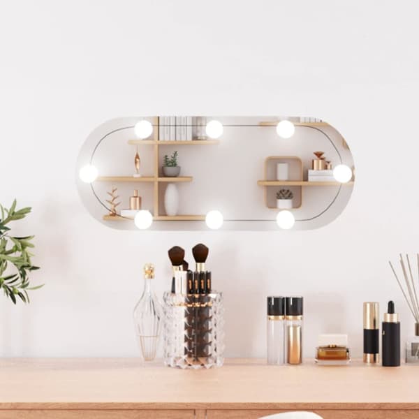 Väggspegel med LED-belysning 20x50 cm glas oval