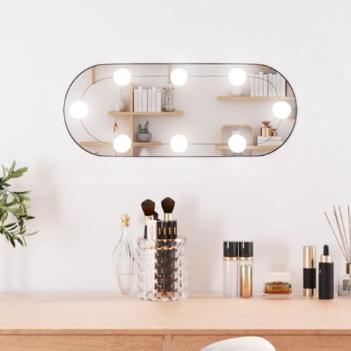 Väggspegel med LED-belysning 25x60 cm glas oval