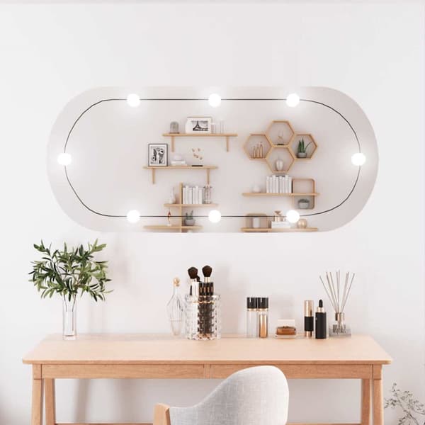 Väggspegel med LED-belysning 45x100 cm glas oval