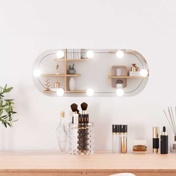 Väggspegel med LED-belysning 20x50 cm glas oval