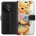 Miniatyrbilde 1 av 3: OnePlus 11 Lommeboketui Nalle Puh med blomster - klassisk barnefavoritt i en blomstrende vår miljø