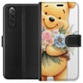 Miniatyrbilde 1 av 3: Sony Xperia 10 V Lommeboketui Nalle Puh med blomster - klassisk barnefavoritt i en blomstrende vår miljø