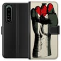 Miniatyrbild 1 av 3: Sony Xperia 5 III Plånboksfodral Hand knuten i Palestinas färger – kraftfull symbol för frihetsrörelsen