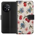 Miniatyrbilde 1 av 3: OnePlus 11 Lommeboketui Bær & Blomster - mønster med blå blomster og skogsbær