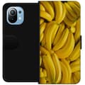Miniatyrbild 1 av 3: Xiaomi Mi 11 Plånboksfodral Banana Pattern – lekfullt mönster med gula bananer