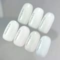 Miniatyrbild 2 av 5: NAILSOFTHEDAY Täckbotten NYHET Milk 06 - halvtransparent mjölkig bas med blått glitter, 10 ml