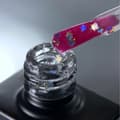 Miniatyrbild 2 av 4: NAILSOFTHEDAY Party topp 04 - transparent topp med holografiska stjärnor, icke-klibbigt lager, 10 ml
