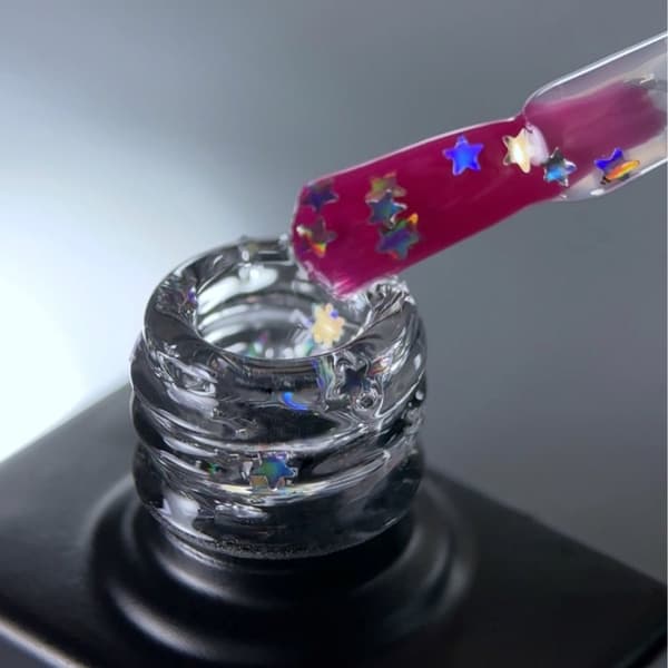 NAILSOFTHEDAY Party topp 04 - transparent topp med holografiska stjärnor, icke-klibbigt lager, 10 ml