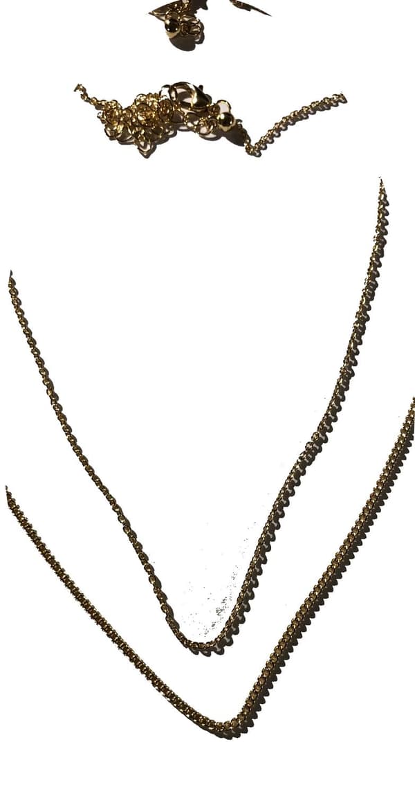 2 halsband som hör ihop guldfärgade