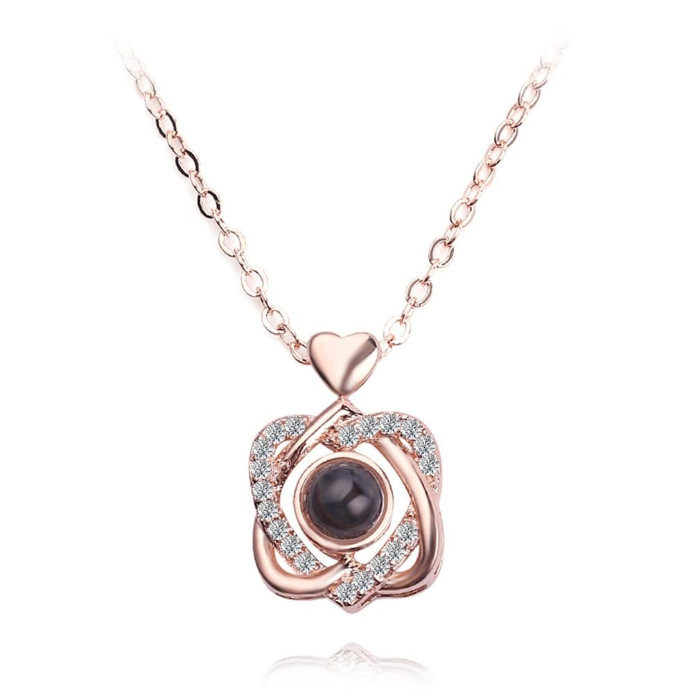Halsband korsande hjärtan med "I love you" på 100 språk Roséguld