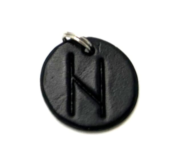 Handmade pendant with nordic rune made of swedish leather