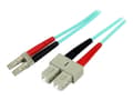 Miniatyrbild 1 av 5: StarTech.com 1m Fiber Optic Cable - 10 Gb Aqua - Multimode Duplex 50/125 - LSZH - LC/SC - OM3 - LC to SC Fiber Patch Cable - Patch-kabel - LC multilä