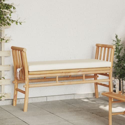 Bänk för trädgården med dyna 110 cm av bambu