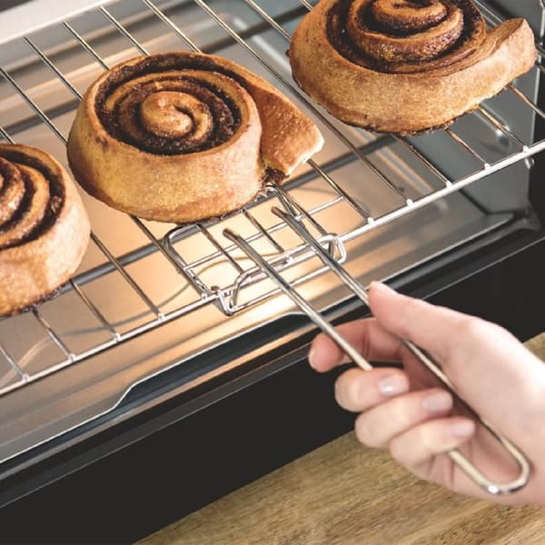 Cecotec Convection oven with rotisserie fork, 46 l capacity, and 12 cooking options.