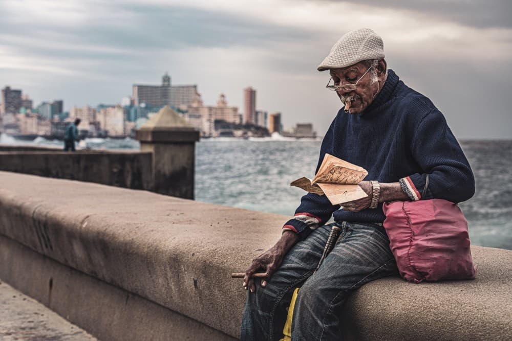Reading On Malecon Poster
