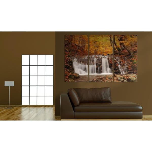 Canvas Tavla - A waterfall in the middle of fall trees