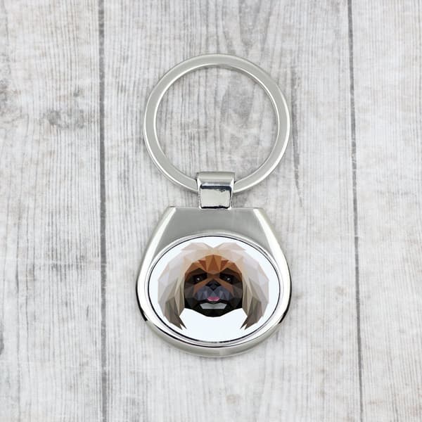 Pekingese - en geometrisk nyckelring med ett foto och inskriptionen Art-Dog