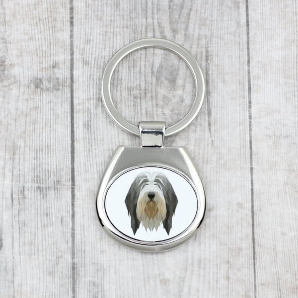 Bearded Collie, Highland Collie - geometrisk nøglering med et foto og inskriptionen Art-Dog