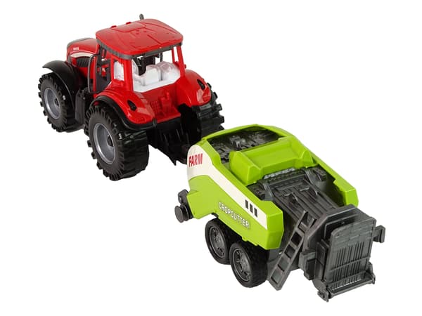 Rød gårdtraktor med grøn såmaskinefriktionsdrev