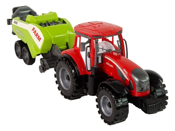Rød gårdtraktor med grøn såmaskinefriktionsdrev