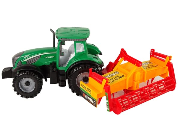 Grön traktor med orange kultivatordrift för barn